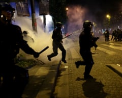 French police clash with football fans in Paris after PSG won  the Champions League final