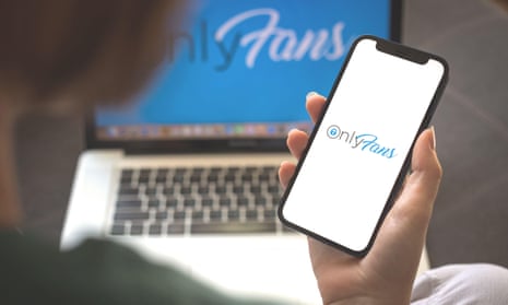 Woman using Onlyfans application. Onlyfans app logo on mobile phone screen