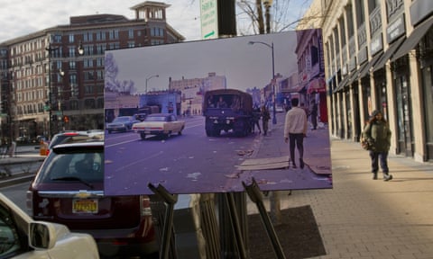 A 1968 photo of a National Guard truck and soldiers is placed on a easel on 14th Street near Park Avenue 
