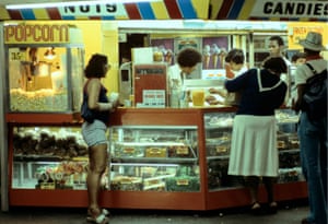a Willy Spiller photo titled "Popcorn and Candy Subway, 1978": customers and staff at a brightly coloured popcorn and candy stall on a subway platform