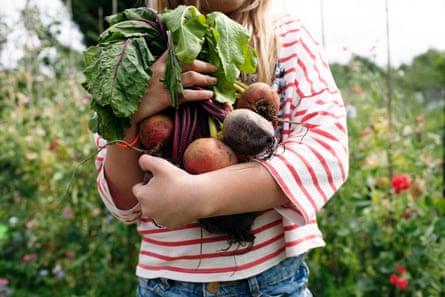 Woman holding beetroot