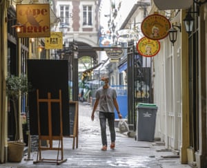 The French government is trying to contain growing virus infections but avoid shutting down the economy.