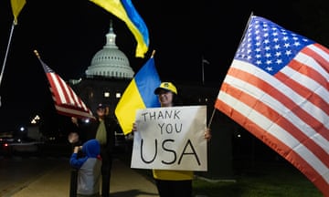 Supporters of Ukraine hold flags outside the US Capitol Building after the Senate passed the $95bn national security supplemental.