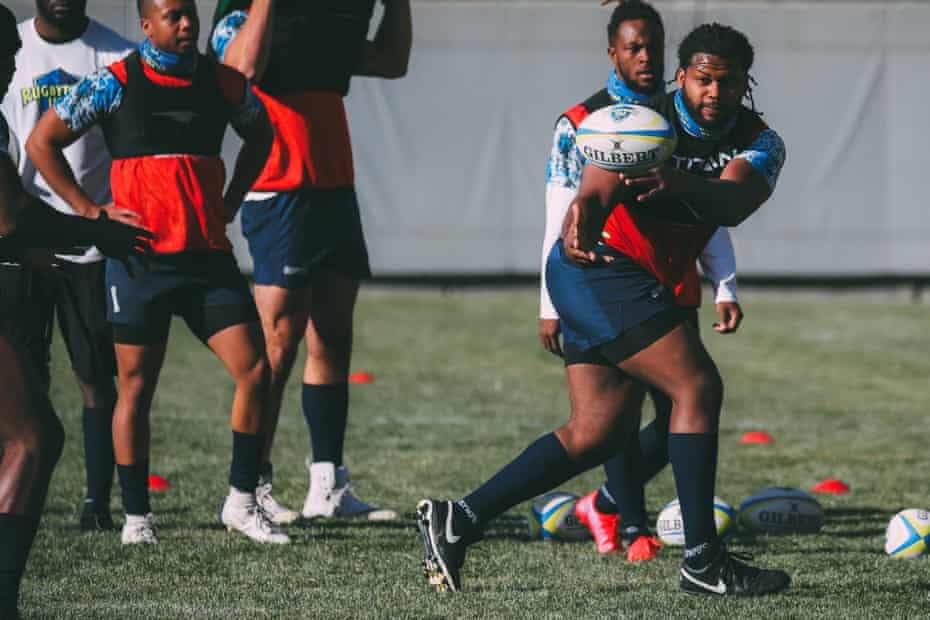 Gelen Robinson, once a defensive tackle in the XFL, gets used to passing a rugby ball.