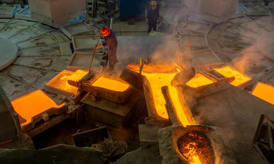 Molten copper flows into molds at a smelting plant of Wuzhou Jinsheng Copper Co Ltd.