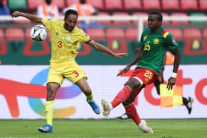 Mohammed Msued vies with Cameroon defender Nouhou Tolo.