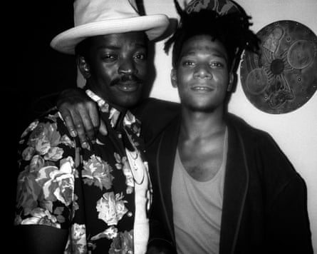 Fab 5 Freddy and Jean-Michel Basquiat standing close together