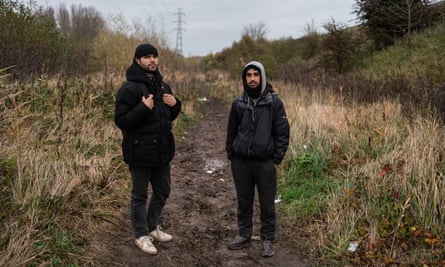 Kasim, 24, and Sahil, 23, two migrants from Afghanistan at a camp in Loon-Plage between Calais and Dunkirk.