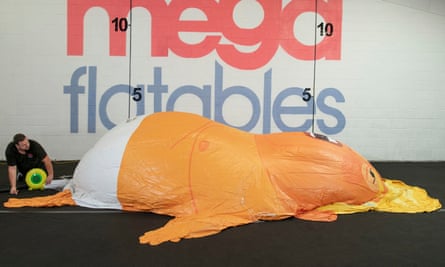 The Donald Trump blimp being inflated by Museum of London staff for testing.