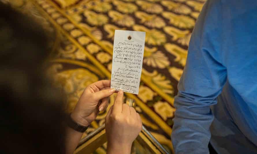 Aya Chebbi holds a hastily written draft of the fatwa on hotel notepaper