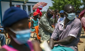 People wait for their Covid-19 jabs in Lawley, South Africa, as the nation accelerates its vaccination campaign a week after the discovery of the Omicron variant.
