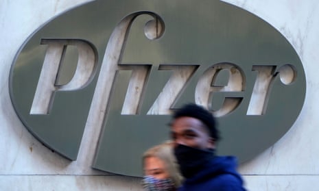 People walk past the Pfizer headquarters building in New York City.