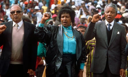 Ahmed Kathrada, left, alongside Winnie and Nelson Mandela at Soweto football stadium in 1990.