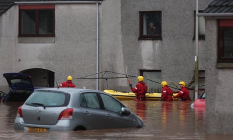 Emergency services assist in the evacuation of people from their homes in Brechin.