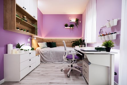 Modern luxury teenage girl’s bedroom with desk and lot of plants. Bright wooden floor and lot of lamps.