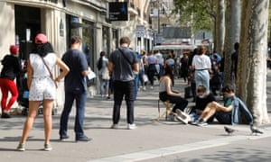 People queue at a testing site for coronavirus in Paris on Friday.