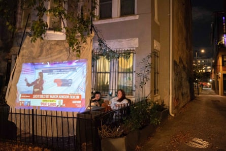 people sitting in front of screen