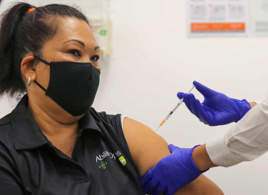 woman receives a vaccination