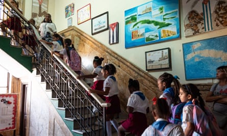 Children walk to their classrooms on their first day of school in Havana on 4 September.