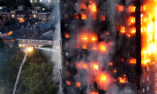 Firefighters tackle the Grenfell Tower blaze as dawn breaks