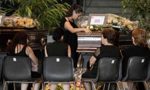 Relatives pay their respects near the coffin of a victim of the Morandi bridge’s collapse, in Genoa.
