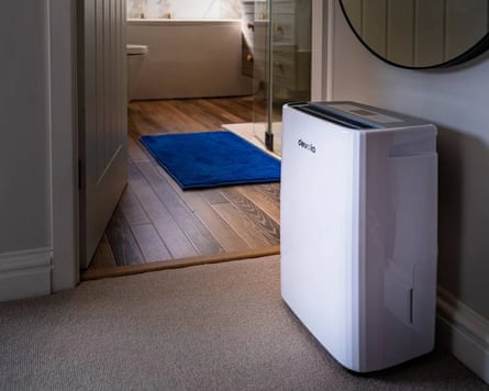 A white Devola 12L Platinum Compressor Dehumidifier in a home