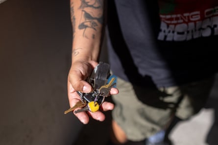 A man holding a bunch of keys.