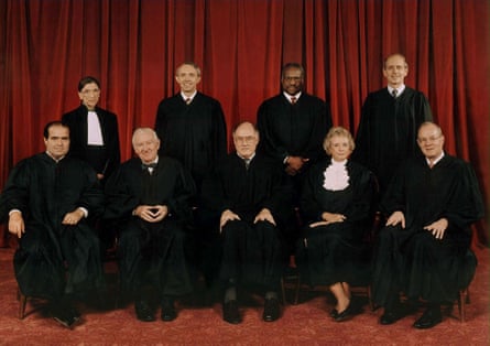 Justices of the US supreme court in 1998, with Souter standing, second left, William Rehnquist, seated, centre, with Sandra Day O’Connor on his left.
