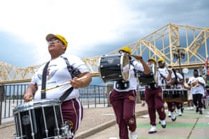 River City Drum Corps marches with a crowd following during the Juneteenth commencement of On the Banks of Freedom on June 19 2021 in Louisville, Kentucky