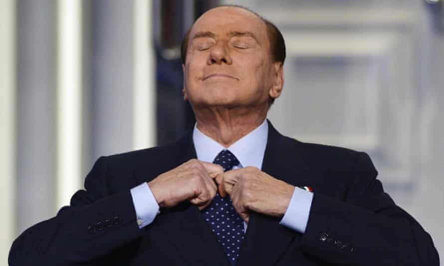 Silvio Berlusconi adjusting his tie during the recording of the Italian Rai 1 television programme ‘Porta a porta’.