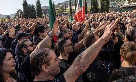 Fascist sympathisers salute outside the cemetery of San Cassiano, where Benito Mussolini is buried