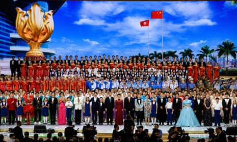 The Chinese president, Xi Jinping (centre, in a red tie), at a variety show in Hong Kong to mark 20 years since Britain returned Hong Kong to China.