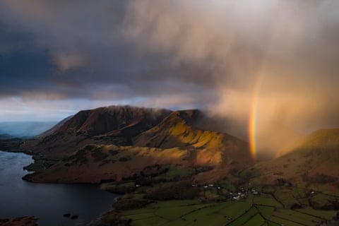 A shower passing over the Lake District, creating a rainbow.