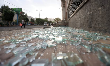 Damage at a cordoned off area after US airstrikes targeted a nearby position, in Sana'a, Yemen.