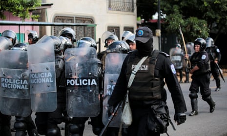 Riot police patrol the streets during a protest against Daniel Ortega in September.