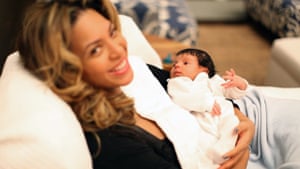 Beyoncé holds the infant Blue Ivy in 2012