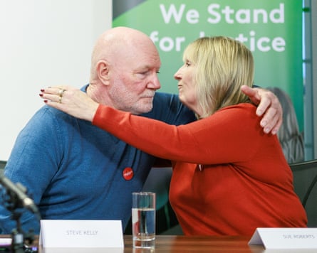 Steve Kelly embraces Sue Roberts.