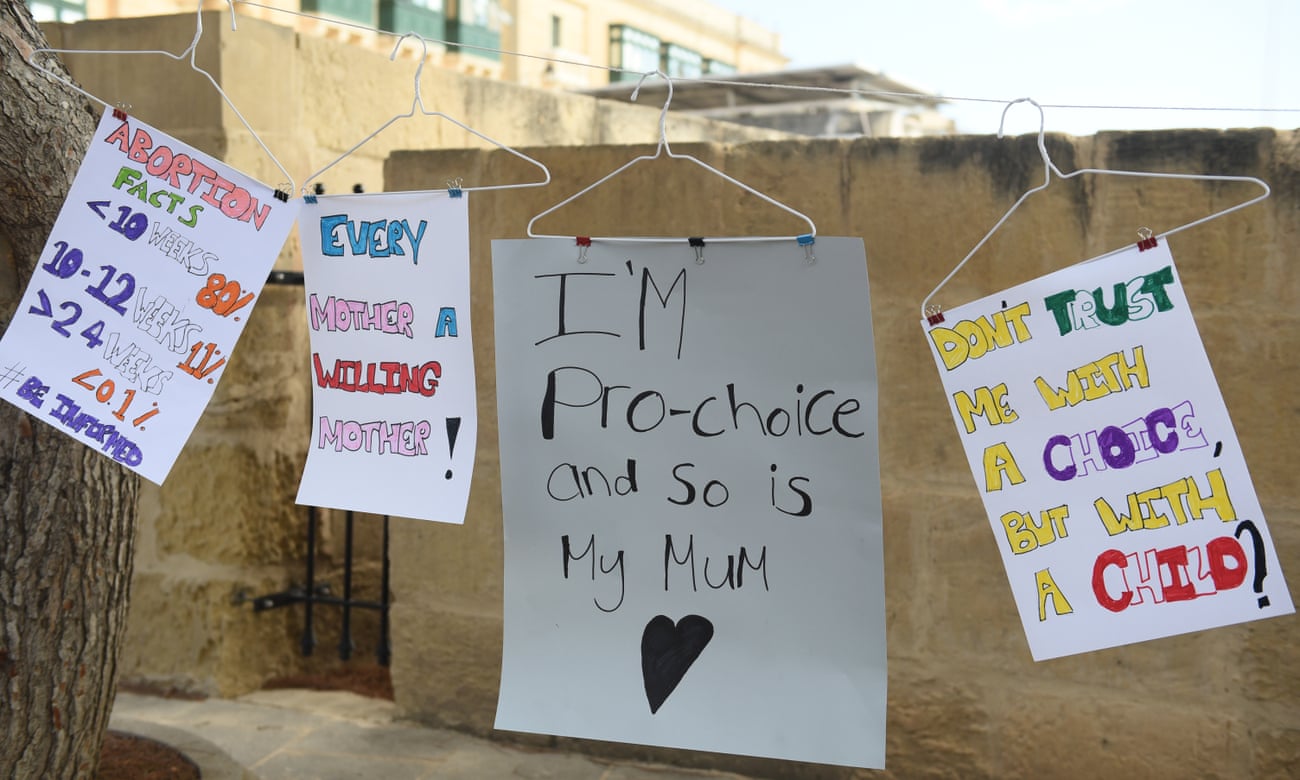 Banners at a pro-choice rally in Malta.