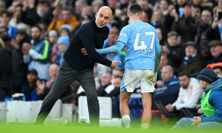 Pep Guardiola and Phil Foden during Manchester City’s 3-1 win against crosstown rivals United at the Etihad Stadium in March.