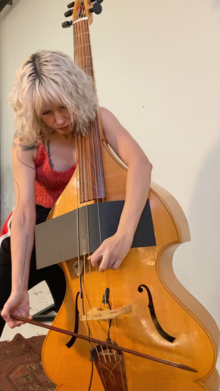 Chloë Sobek performing the violone – with added cardboard.