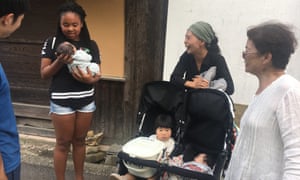 The author's daughter meets local people.