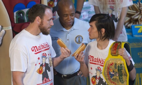 Matt Stonie, right, reigning hot dog-eating champion, stares down eight-time champion Joey Chestnut during the official weigh in for Nathans Famous hot dog eating contest on Friday.