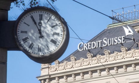 The logo of Swiss bank Credit Suisse near a big clock in Zurich, Switzerland.