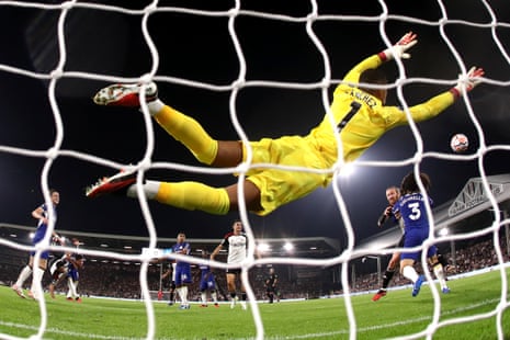2 October 2023 Robert Sánchez of Chelsea saves a header from Raúl Jiménez of Fulham at Craven Cottage.