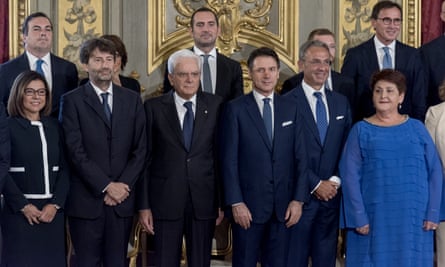 Italy’s president, Sergio Mattarella, and Conte (both centre) pose with members of the new cabinet