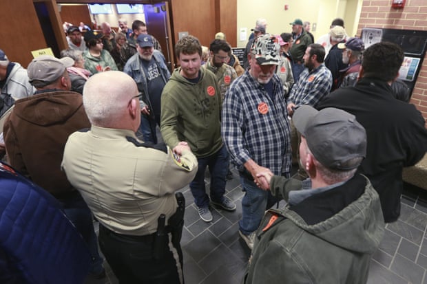 Spectators file out of a packed Buckingham county board of supervisors meeting after the board unanimously voted to pass a second amendment sanctuary city resolution in Buckingham, Virginia.