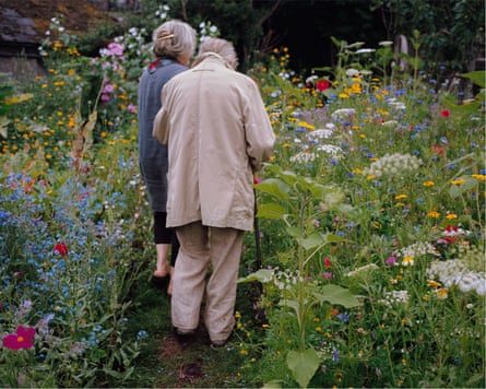 An elderly couple in the garden