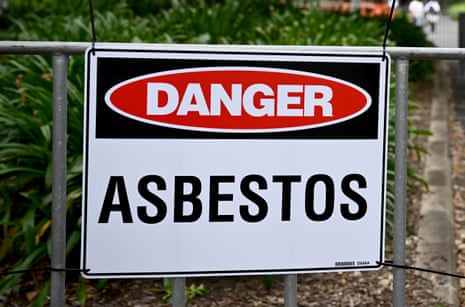 Asbestos signs are displayed at a park