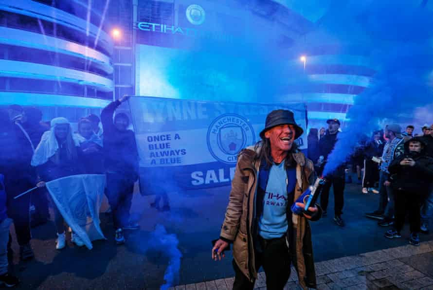 Manchester City fans celebrate at the Etihad Stadium after their team were crowned Premier League champions following Manchester United’s home defeat to Leicester on May 11th 2021.