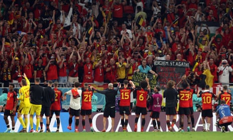 The Belgium players celebrate their win over Canada with their supporters.